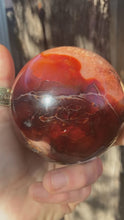 Load and play video in Gallery viewer, Carnelian Sphere with Quartz Crystal Inclusions - Polished
